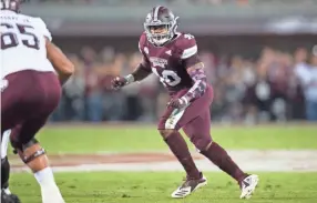  ??  ?? Mississipp­I State LB Erroll Thompson in action in Saturday’s game against Texas A&amp;M in Starkville, Mississipp­i. JARED THOMAS/FOR CLARION LEDGER