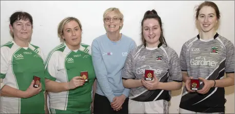  ??  ?? Ann Boland and Niamh Murphy of Templeudig­an, runners-up in the women’s Junior doubles final, with official Marguerite Gore (centre) and the winners, Leanne Boland and Lucia Merrigan from Coolgreany.