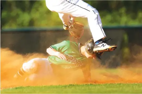  ?? STAFF PHOTOS BY TROY STOLT ?? East Hamilton first baseman Chase Roberts, bottom, steals second base during a game against Soddy-Daisy on Monday in Ooltewah.