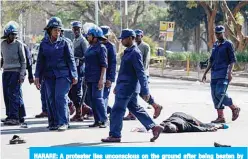  ??  ?? HARARE: A protester lies unconsciou­s on the ground after being beaten by police near Unity Square in Harare. —AFP