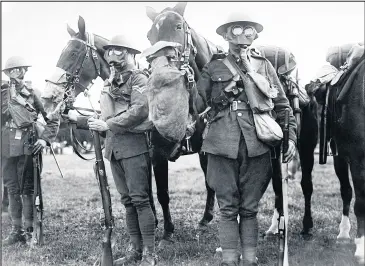  ??  ?? World War One. Army Efficiency Tests. Horses and men in gas masks. September 1917. Photo Daily Mirror