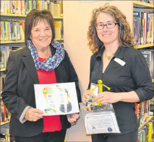  ?? KATIE SMITH/THE GUARDIAN ?? Cornwall Mayor Minerva McCourt, left, and the town’s librarian, Pam Wheatley, are pleased the library is becoming a more inclusive space for everyone.