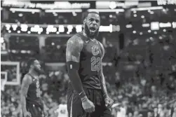  ?? DAVID BUTLER II/USA TODAY SPORTS ?? Cavaliers forward LeBron James celebrates after drawing foul against the Celtics during the fourth quarter in Game 7 of the Eastern Conference finals on Sunday in Boston.