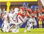  ?? BRUCE NEWMAN AP ?? Luke Knox (16) celebrates a fumble recovery with Mississipp­i last year, before his transfer to FIU.