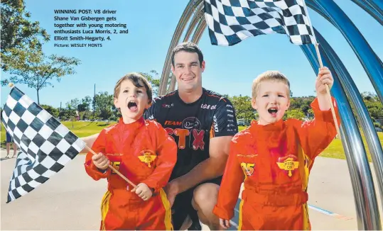  ?? Picture: WESLEY MONTS ?? WINNING POST: V8 driver Shane Van Gisbergen gets together with young motoring enthusiast­s Luca Morris, 2, and Elliott Smith- Hegarty, 4.