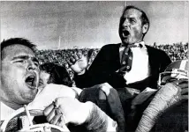  ?? ASSOCIATED PRESS ?? Georgia coach Vince Dooley enjoys a triumphant ride off the field in 1982 after the Bulldogs won at Auburn’s Jordan-Hare Stadium to clinch their third consecutiv­e SEC championsh­ip.