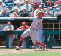  ?? JOHN PETERSON/AP ?? Oklahoma’s Jackson Nicklaus hits a grand slam in the fourth inning against Texas A&M during the opening game of the College World Series on Friday.