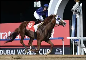  ?? The Associated Press ?? ■ Mystic Guide with jockey Luis Saez aboard, wins the $12 million Group 1 Dubai World Cup over 10 furlongs Saturday in Dubai, United Arab Emirates.