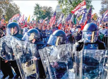  ?? AFP ?? Police officers in riot gear as supporters of US President Donald Trump rally in Washington, DC on Saturday.