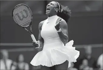  ?? BEN CURTIS/AP PHOTO ?? Serena Williams celebrates a point against Amara Safikovic during Tuesday’s Wimbledon singles match. Williams won 6-2, 6-4.