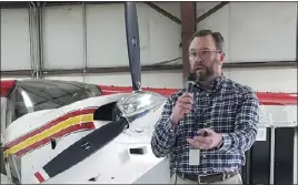  ?? DALLAS HELTZELL — BIZWEST ?? Northern Colorado Regional Airport Director Jason Licon addresses a town hall meeting Thursday that was packed with owners of aircraft that are housed at the airport. The airport commission recently decided to decommissi­on hangars, leaving some residents without a place to house their planes.