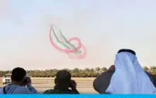  ??  ?? People take pictures of Saudi falcon Hawk Mk 65 aircraft performing during the Kuwait aviation show.