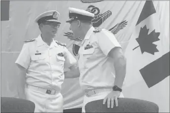  ?? CP PHOTO ?? Royal Canadian Navy Vice-Admiral Mark Norman, left, speaks with Vice-Admiral Ron Lloyd during a change of command ceremony in Ottawa. Prime Minister Justin Trudeau says the police investigat­ion into Norman will “inevitably” lead to “court processes,”...