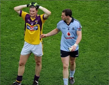  ??  ?? Dublin’s Philly McMahon consoling a devastated David Murphy after the game.