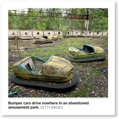  ?? GETTY IMAGES ?? Bumper cars drive nowhere in an abandoned amusement park.