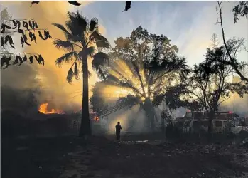  ?? Adam L. Wiedmann European Pressphoto Agency ?? A VIEW from Lower Lake of the Clayton fire. The blaze scorched more than 4,000 acres and 1,300 homes, many of them mobile homes and rentals, in Lake County. Lower Lake was hit particular­ly hard.