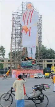  ?? SUBHANKAR CHAKRABORT­Y/HT PHOTO ?? A 110 ft cutout of Prime Minister Narendra Modi in front of Vidhan Bhavan on the eve of his birthday in Lucknow.