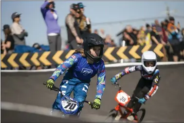  ?? PHOTOS BY SHAE HAMMOND — STAFF PHOTOGRAPH­ER ?? BMX riders race during state qualifiers at the Santa Clara PAL BMX Track in Santa Clara on Feb. 6. There were 890riders of varying age groups and skill level participat­ing in the competitio­n.