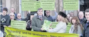  ??  ?? ●» Some of the Save Macclesfie­ld Green Belt campaigner­s presenting the 500 written objections to MP David Rutley