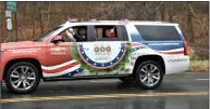  ?? Bill O'Brien / For Hearst Connecticu­t Media ?? Specially wrapped Wreaths Across America vehicle rolling through Branford as part of America's longest veterans parade last year.