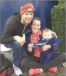  ?? Special to The Okanagan Weekend ?? Kelowna’s Malindi Elmore with her husband Graham Hood and their new son Oliver at the Houston Marathon.