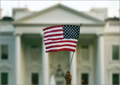  ?? CAROLYN KASTER — THE ASSOCIATED PRESS ?? In this Sept. 2017 file photo, a flag is waved outside the White House, in Washington. The Trump administra­tion is coming out with new visa restrictio­ns aimed at restrictin­g a practice known as “birth tourism.” That refers to cases when women travel to the United States to give birth so their children can have U.S. citizenshi­p.