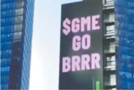  ?? CREDIT: TIKTOK ?? Reddit users use a five-storey electronic billboard in Times Square last Friday flaunting shares in GameStop. The text — “$GME GO
BRRR” — was a nod to a meme last spring that mimicked the sound of cash being printed by the Fed: “Money printer go brrr.”