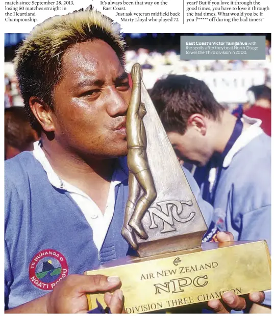  ??  ?? East Coast’s Victor Taingahue with the spoils after they beat North Otago to win the Third division in 2000.