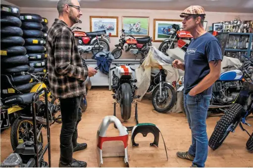  ??  ?? Inside the man-cave. James has just bought a TZ750 (centre), which he'll recommissi­on and parade. The T140 was bought as a donor bike, but was too good to cannibalis­e