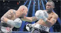  ?? HENNY RAY ABRAMS/THE ASSOCIATED PRESS ?? Austin Trout, right, who successful­ly defended his WBA junior middleweig­ht title Saturday in New York vs. Miguel Cotto, left, will attend Friday’s fight card at Route 66 Casino Hotel.