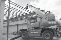  ?? Submitted photo ?? ■ Workers from Routh Enterprise­s work on the Museum of the Red River’s new roof and air conditioni­ng system.