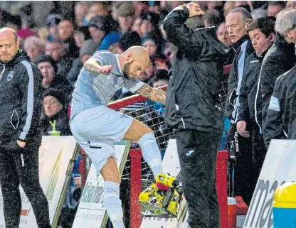  ?? Picture: SNS. ?? Dunfermlin­e’s Kallum Higginboth­am kicks a board in frustratio­n after his red card.