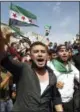  ?? COURTESY OF MUSTAFA ALABDULLAH VIA AP ?? This image courtesy of Mustafa Alabdullah, an activist and resident of Idlib, shows protesters chanting as they hold Syrian revolution flags, in Harim, a town in Idlib province, Syria, Friday.