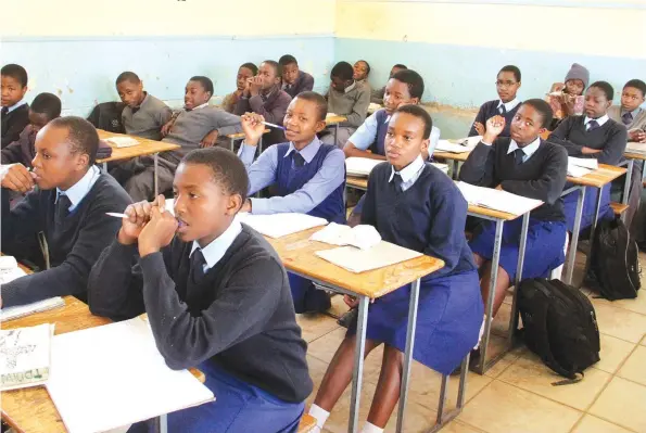  ?? Picture: Kudakwashe Hunda ?? Schools are demanding pupils to bring their own desks, chairs and mattresses, a developmen­t that has irked parents. —