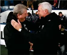  ?? ?? MUTUAL APPRECIATI­ON: Roy Hodgson (left) receives a warm welcome from Alan Pardew at the Hawthorns yesterday