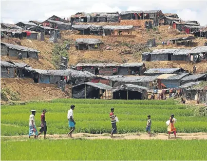  ??  ?? HOMELESS: Refugee Rohingya Muslims live in makeshift camps on hills at Cox’s Bazar in Bangladesh