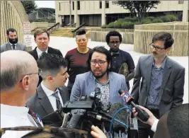  ?? Jonathan Drew ?? The Associated Press Plaintiff Joaquin Carcano, center, addresses reporters Monday after a hearing in Winston-salem, N.C., on a lawsuit challengin­g the law that replaced North Carolina’s “bathroom bill.”