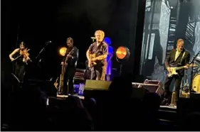  ?? Pittsburgh Post-Gazette ?? John Mellencamp, center, at the Benedum Center on Monday night.