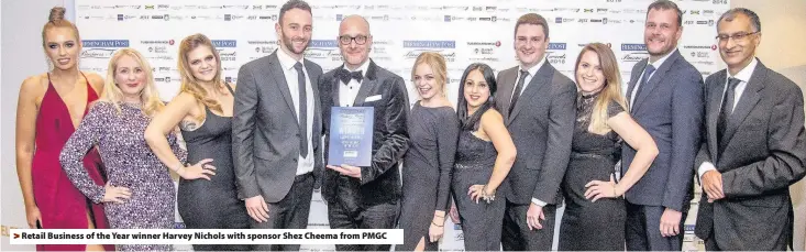  ??  ?? > Retail Business of the Year winner Harvey Nichols with sponsor Shez Cheema from PMGC