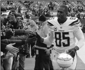  ?? Associated Press ?? SAYING GOODBYE
In this Dec. 24, 2017, file photo, Chargers tight end Antonio Gates (85) greets fans before a game against the New York Jets. Gates announced his retirement, Tuesday, following a 16-year career.