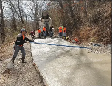  ?? NWA Democrat-Gazette/FLIP PUTTHOFF ?? The gravel baseof a trail around Lake Atalanta is ready March 4 for concrete.