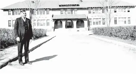  ?? COURTESY OF THE MENAUL HISTORICAL LIBRARY OF THE SOUTHWEST ?? Harper Donaldson stands in front of the hall at Menaul School that was named after him.