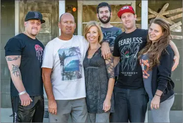  ?? Cory Rubin/The Signal ?? From left: Joey Bush, owner William “Bond” Landeen, Jill Landeen, Jeff Grimaud, Joshua Bradeis and Kimberly Pearson transforme­d Landeen’s garage into Hawkins, Indiana, for their “Stanger Things” haunted house in Saugus.
