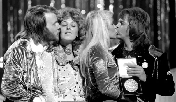  ?? ?? The pop group Abba congratula­te each other in Brighton, a er winning the 1974 Eurovision Song Contest for Sweden with Waterloo, sung by the girls, Annifrid Lyngstad (Frida), second le , and Agnetha Faltskog (Anna). The other group members, Benny Andersson, le , and Bjorn Ulvaeus, composed the song