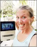  ??  ?? In this selfie provided by Beth Berglin, she shows a screen where she joins a Burn Boot Camp live-stream workout from her home on March 19 in Coral Gables, Fla. People around the country who are selfisolat­ing or maintainin­g social distance during the coronaviru­s outbreak have to think outside the gym when it comes to their fitness routines. Many are turning to online classes or getting outside to exercise. (AP) They said the company also has received tons of requests from desperate parents now