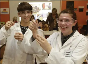  ??  ?? Robin Keogh and Mia Holmes in the science lab at the North Wicklow Educate Together open night.