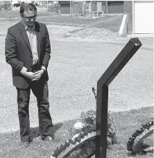  ?? CONTRIBUTE­D ?? Cape Breton Canso MP Mike Kelloway has a few minutes of silence after laying a wreath to commemorat­e Davis Day in the Miners’ Memorial Park at the Cape Breton Miners’ Museum in Glace Bay, Thursday.