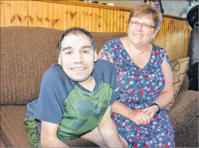  ?? COLIN MACLEAN/JOURNAL PIONEER ?? Ty Caissie and his sister-in-law and guardian, Linda Gallant, are shown in their Miscouche home. Caissie was recently cured of hepatitis C and plans to celebrate with a trip to Nashville.