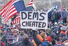  ??  ?? In this Jan. 6 photo, Trump supporters gather outside the Capitol in Washington. [JOHN MINCHILLO/ASSOCIATED PRESS FILE PHOTO]