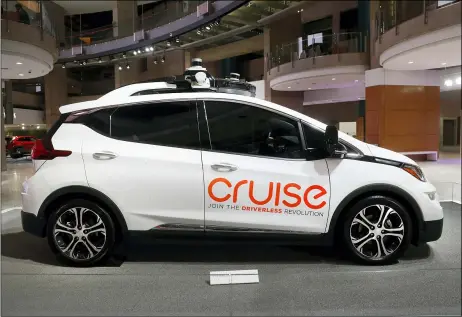  ?? AP PHOTO/PAUL SANCYA, FILE ?? Cruise AV, General Motor’s autonomous electric Bolt EV is displayed in Detroit. General Motors’ self-driving car company is sending vehicles without anybody behind the wheel in San Francisco as it navigates its way toward launching a robotic taxi service that would compete against Uber and Lyft in the hometown of the leading ride-hailing services. The move announced Wednesday, Dec. 9, 2020, by GM-owned Cruise come two months after the company received California’s permission to fully driverless cars in the state.